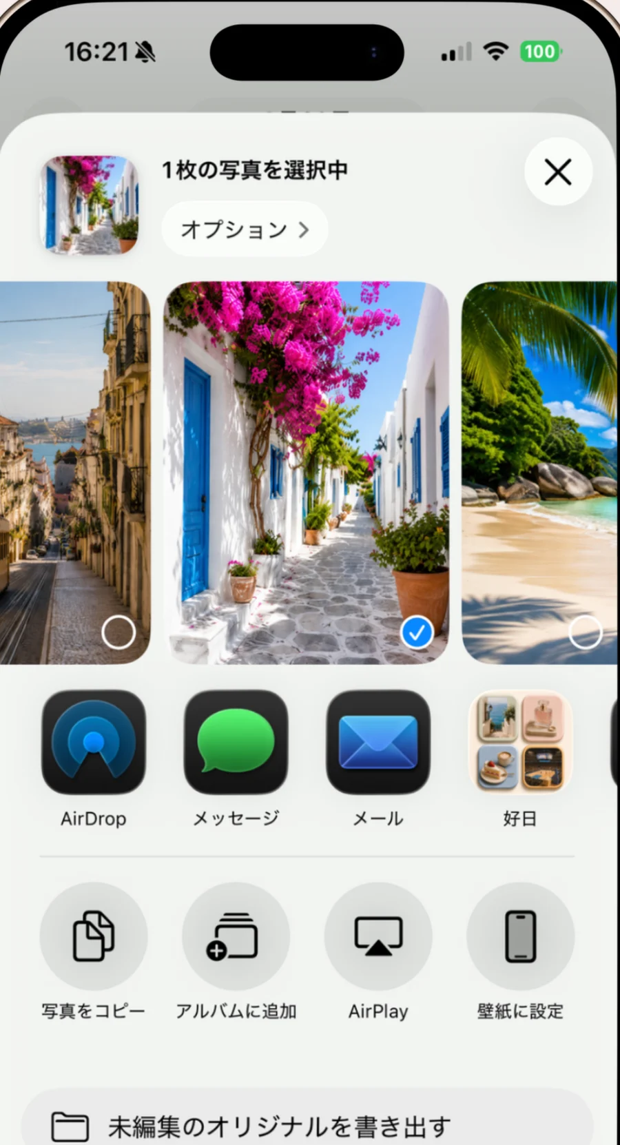 iPhoneの共有メニュー。写真を選んだ状態で、共有先のアプリの並びに「好日」が表示されている